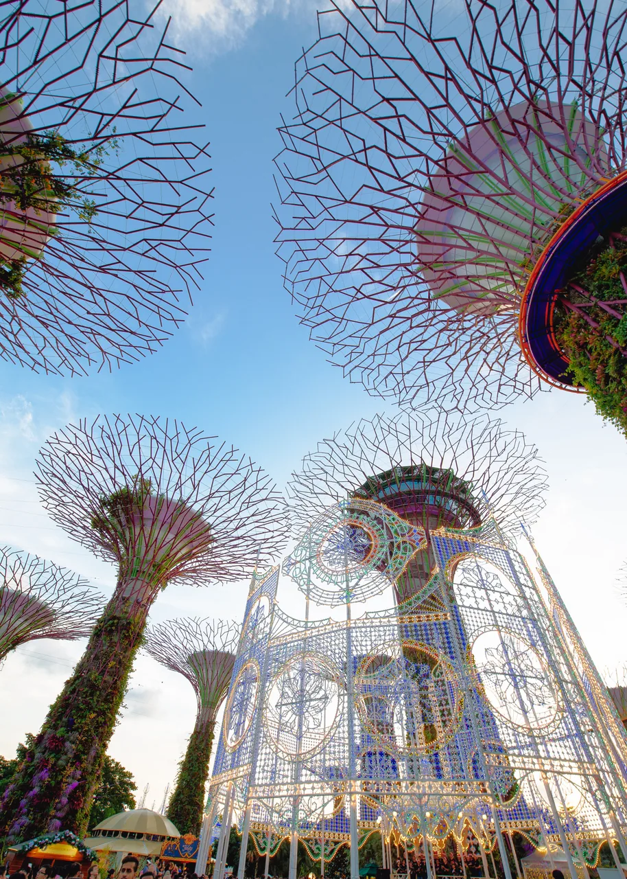 A large illuminated Christmas structure beside the Supertrees at Gardens by the Bay